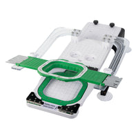 Green 3.9-inch magnetic embroidery hoop positioned on the flat HoopTalent hooping board